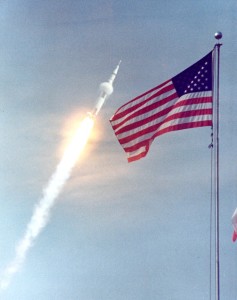 Apollo 11 shoots by US flag