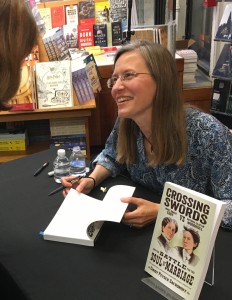 Safronoff signing copies of Crossing Swords